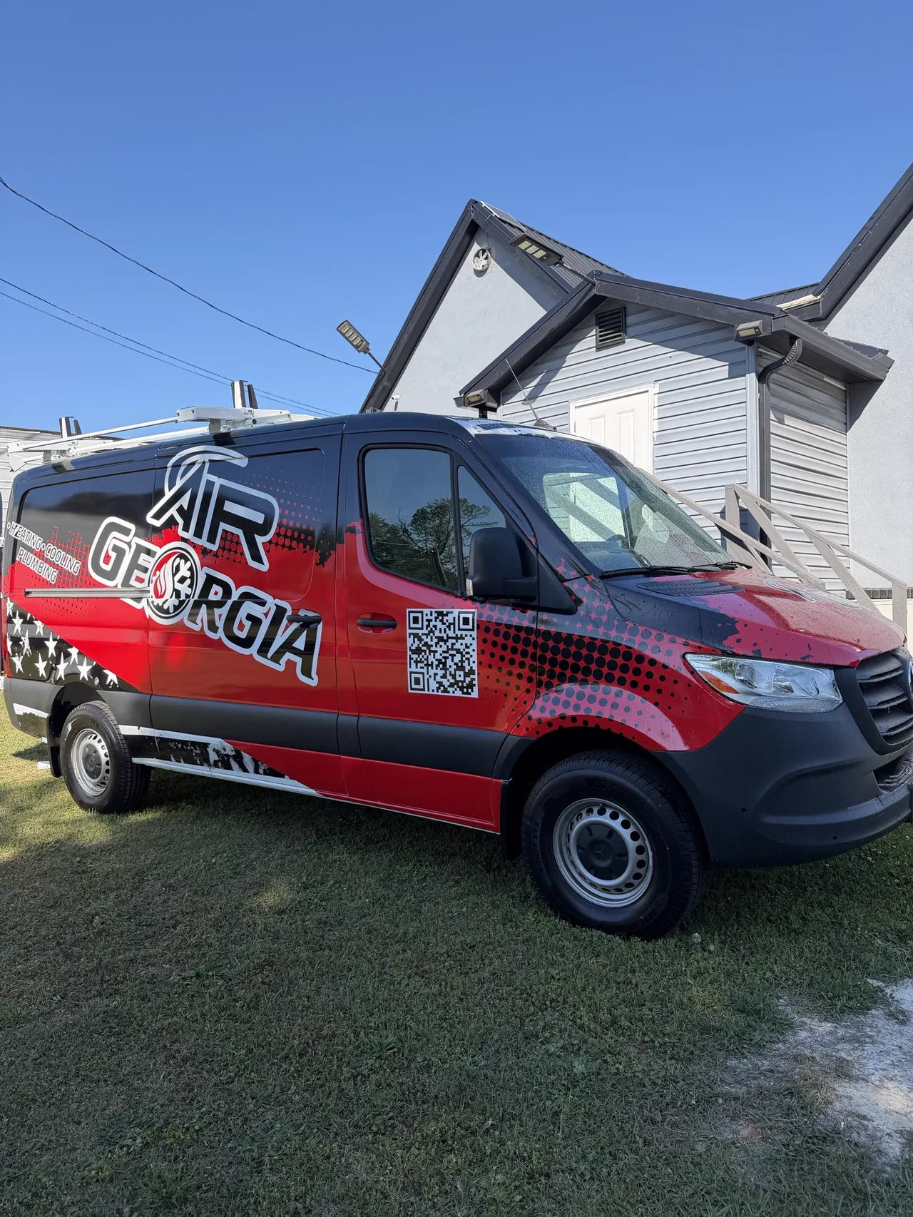 Air Georgia van, passenger side, with the Air Georgia logo and a QR code