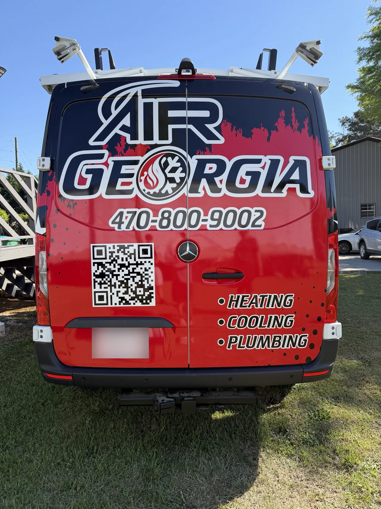 Air Georgia van, rear doors, with the logo, phone number and services