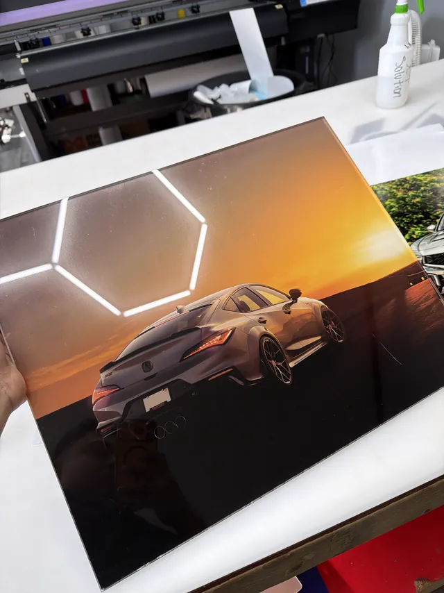A finished print coming off the wide-format printer at W&W Signs